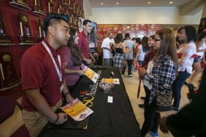 USC Auxiliary job recruiters speak with visitors at the job fair. (Photo/David Sprague)